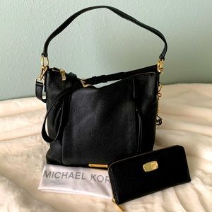 Black pebble leather Michael Kors shoulder crossbody purse with matching wallet.